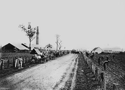 StateLibQld 1 170743 Road through Te Kowai Sugar Mill, Mackay, Queensland, ca. 1880.jpg