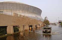 A United States National Guard humvee patrols Poydras Street outside of the Superdome. SuperdomeHumvee5Sept05.jpg