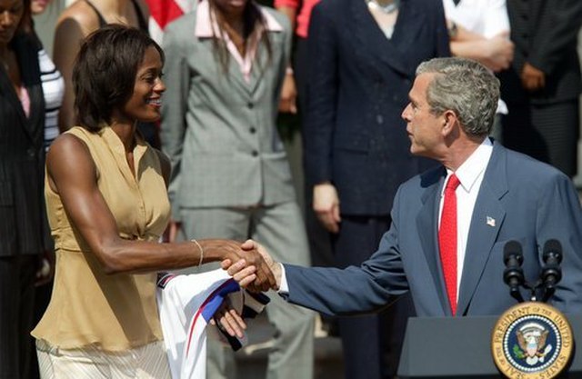Swin Cash meets George W. Bush after winning the WNBA Championship with the Detroit Shock in May 2004