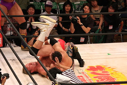 Tajiri performing a roll-up on Lance Cade.