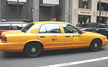 New York medallion taxicab in a prior livery. The medallion number is on the side of the taxicab. USACab.JPG