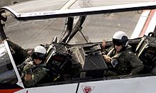 Instructor and student pilots in a McDonnell Douglas T-45 Goshawk aircraft US Navy 061017-N-7130B-030 An instructor pilot is joined by his student in the cockpit of a T-45A Goshawk on the flight deck aboard the Nimitz-class aircraft carrier USS Ronald Reagan (CVN 76).jpg