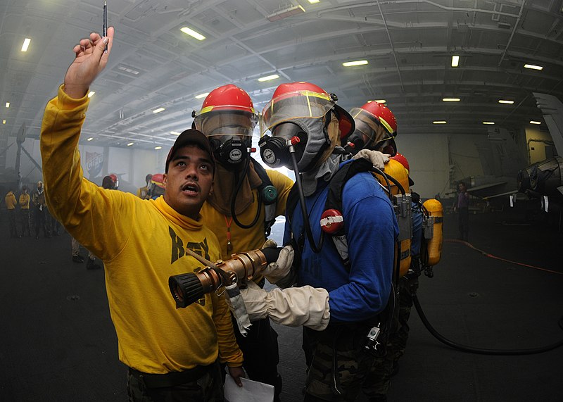 File:US Navy 090825-N-6567V-026 Aviation Boatswain's Mate (Handling) 1st Class Sherwin Denetrio instructs Sailors on proper firefighting techniques during a general quarters drill aboard the aircraft carrier USS George Washington (C.jpg