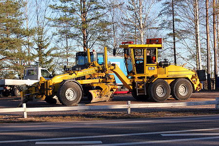 Grader in autumn light