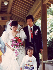 Taiwanese couple dressed Western-style for keepsake photos in the park, 1989
