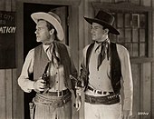 Chandler and John Wayne in Winds of the Wasteland (1936)