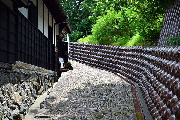 Alley in Tokoname with reinforced pottery walls as seen in the film
