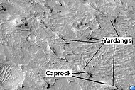 Yardangs in Medusae Fossae Formation with caprock labeled, as seen by HiRISE. Location is Aeolis quadrangle.