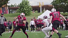 York Lions QB Brett Hunchak evades a tackler at 2019 game vs. McMaster Marauders (09/14/2019). York Lions Football 2019.jpg