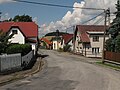 Čeština: Hlavní silnice v Čeňovicích. Okres Benešov, Česká republika. English: Main road in the wall in Čeňovice village, Benešov District, Czech Republic.