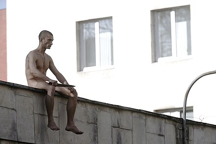 Petr Pavlensky cutting his own ear in a political action in the Red Square of Moscow