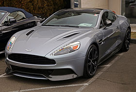 A silver sports coupe with black five-spoke wheels