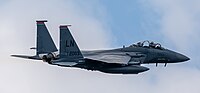 An F-15E Strike Eagle, tail number 01-2003, taking off from RAF Lakenheath in England. The aircraft is assigned to the 494th Fighter Squadron.