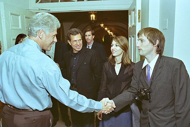 Actor Spike Jonze greets Bill Clinton at screening in the White House.