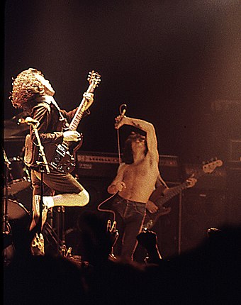 Former vocalist Bon Scott (centre) pictured with guitarist Angus Young (left) and bassist Cliff Williams (back), performing at the Ulster Hall in August 1979