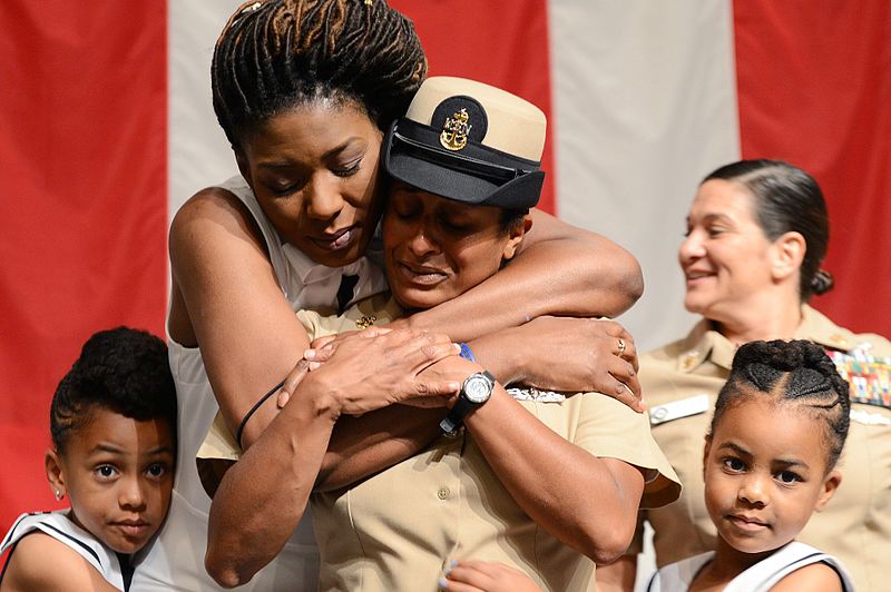 File:A Sailor is embraced by her family after being promoted to the rank of senior chief. (35067280351).jpg