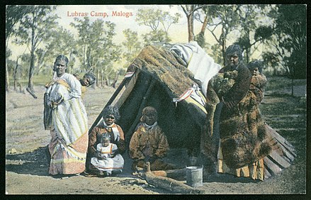 Historical image of Aboriginal Australian women and children, Maloga, New South Wales around 1900 (in European dress)