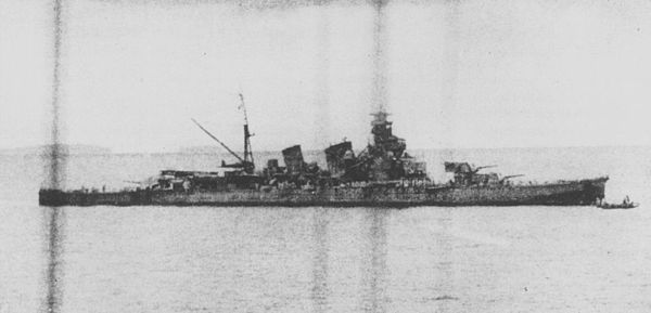 The heavily damaged Japanese cruiser Aoba disembarks dead and wounded crew members near Buin, Bougainville and the Shortland Islands a few hours after