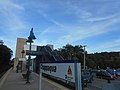 The south end of the platform where the pedestrian bridge and pillars/elevator shafts can be seen.