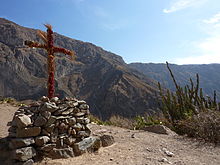 Cross with geraniums, Malata, Cabanaconde, Peru.jpg