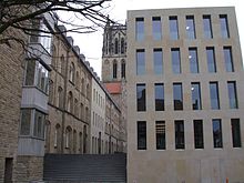View of the library's west wing, the tower of the Überwasserkirche in the background