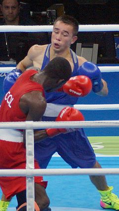 Boxers wear athletic shirts, red outfit for a higher-ranked contender, blue for a lower-ranked. Hasanboy Dusmatov Rio2016.jpg