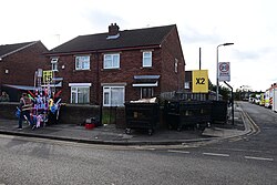 Fair-related street furniture stacked outside an average semi-detached Walton Street house at the 2023 instalment of Hull Fair.