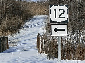 Wintertime photograph of the snow-covered bike trail