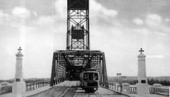 a tram approaching Interstate Bridge, photo in black and white