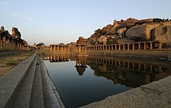 Market place at Hampi and the sacred tank located near the Krishna temple