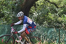 רוכב האופניים הגואמי דרק הורטון במהלך אולימפיאדת לונדון