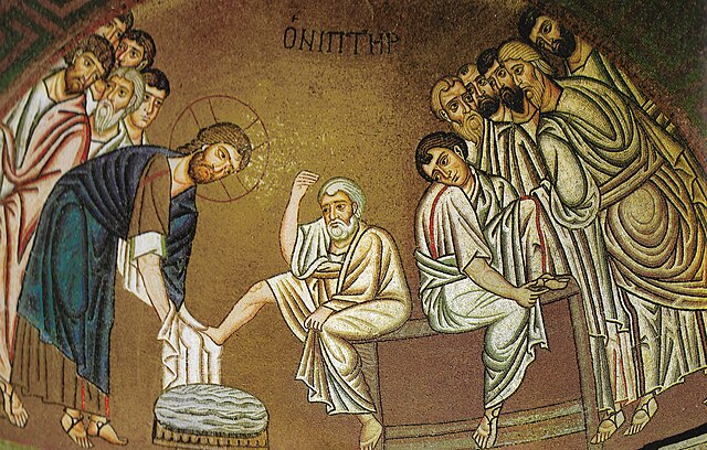 An ancient mosaic depicting footwashing done by Jesus to his disciples