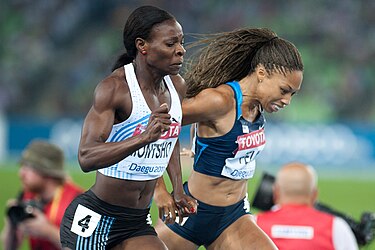 The finish of the women's 400 metres at Daegu, Allyson Felix straining to try to catch Amantle Montsho Montsho Felix Daegu 2011.jpg