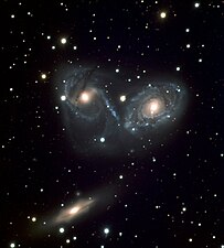 A triplet of galaxies seen by VIMOS