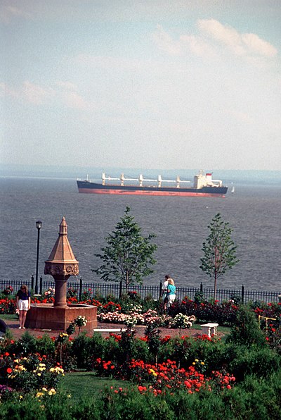Duluth Rose Garden in Leif Erikson Park, with lake freighter passing