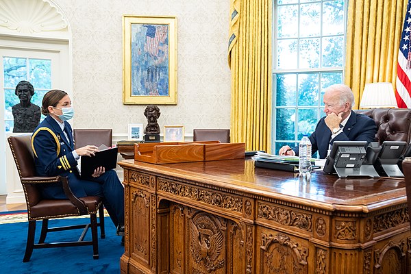 President Joe Biden meets with Coast Guard aide Lieutenant Commander Jayna McCarron about Medal of Honor recipients, Wednesday, October 6, 2021, in th