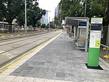 The completed northbound tram stop in January 2024 Parkville Station Northbound Tram Stop January 2024.jpg