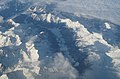Shadows of mountains in a gray winter valley - a photo of European Alps near of winter solstice.