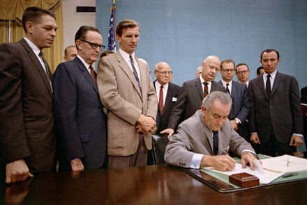 President Lyndon B. Johnson signs the Gun Control Act of 1968 into law.