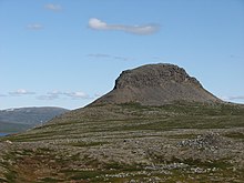 Caledonian schist and gneiss form a hard cap at the top of Saivaara (a mountain in Enontekio) covering the sedimentary rocks of the lower part of the mountain Saivaara.JPG