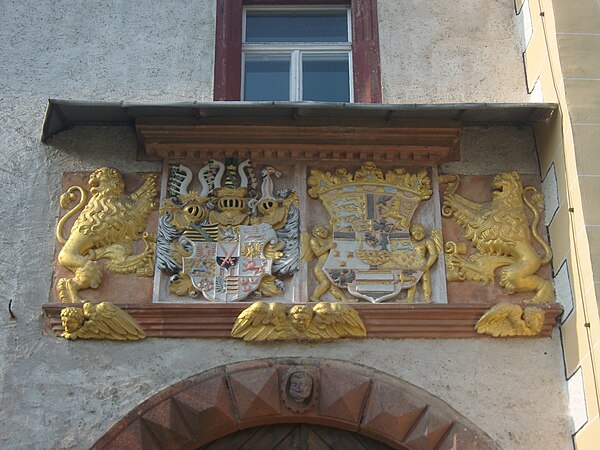 Coat of arms of Augustus of Saxony and his wife Anne of Denmark over the gate to the outer courtyard