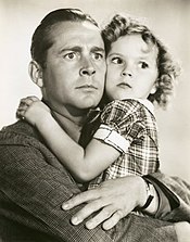 Dunn and Shirley Temple in a publicity photo for Bright Eyes (1934)