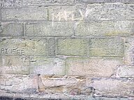 Inscribed graffiti on the north wall