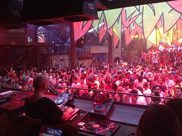 DJ Sven Väth mixes tracks for a crowd of dancers at Amnesia, an Ibiza nightclub, in 2013.