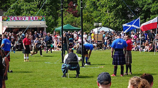 Weight over the bar event at the Carmunnock Highland Games, Scotland