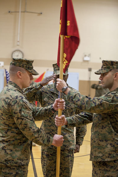 File:U.S. Marine Corps Capt. Robert M. Murray (right), outgoing company commander, passes off the Company guidon to Capt. Adam Sankovsky (left), incoming company commander, Headquarters and Service Company (H&S 131212-M-AX605-018.jpg