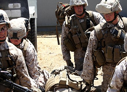 Marines of the 4th Division prepare to move a simulated casualty to a helicopter at Camp Pendleton
