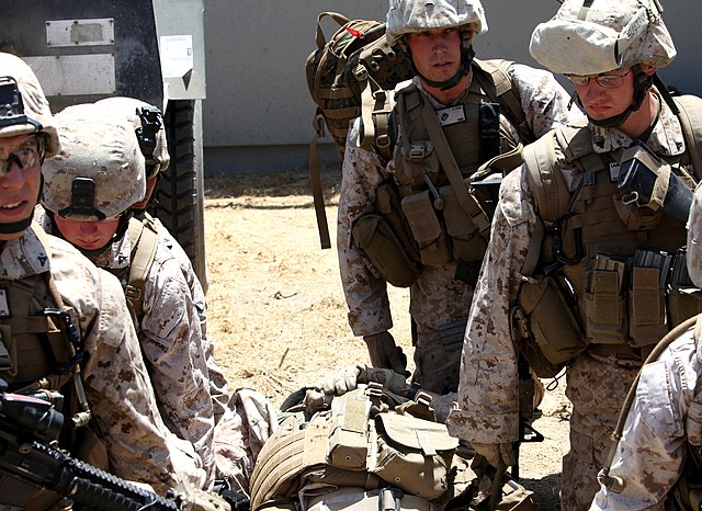 Marines of the 4th Division prepare to move a simulated casualty to a helicopter at Camp Pendleton