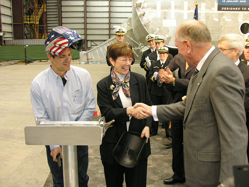 File:US Navy 060119-N-0000X-001 The Assistant Secretary of the Navy for Research, Development and Acquisition, the Honorable Delores Etter, center, shakes hands with Executive Chairman of Austal Ltd., Mr. John Rothwell.jpg