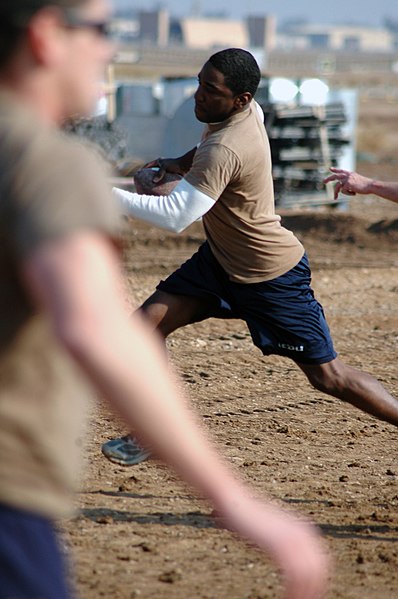 File:US Navy 080112-N-7367K-006 Builder 3rd Class Bryan Williams, assigned to Naval Mobile Construction Battalion (NMCB) 1, Task Force Sierra, scrambles out of a defender's reach in a two-hand-touch football game during the detachme.jpg